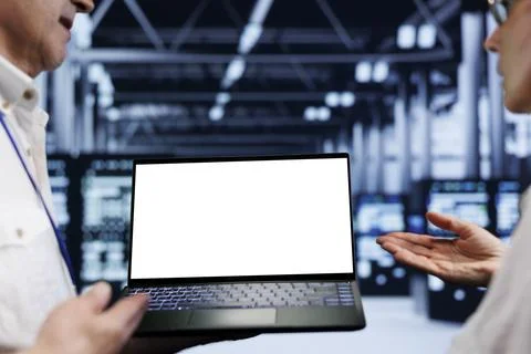 Employee using laptop in data center Foto stock