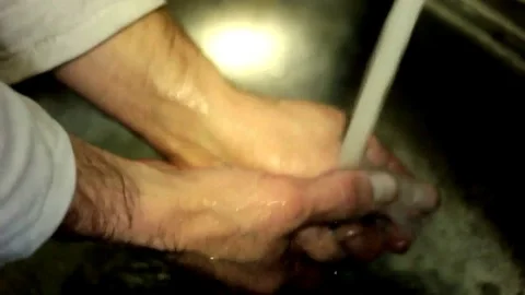 Employee washes hands dirty Stock Footage 71184411