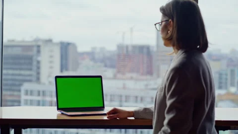 Employee watching greenscreen computer at panoramic cityscape workplace closeup Stock Footage 335246468