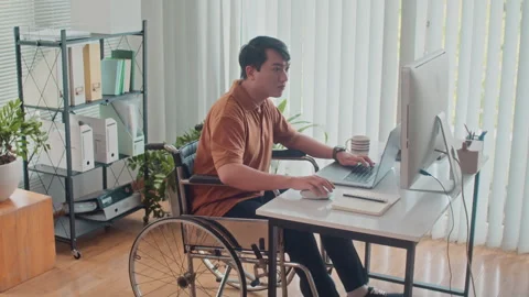 Employee in Wheelchair Developing Code on Computer Stock Footage 265073138