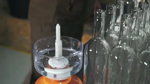 An employee of a winery washes bottles Stock Footage 238354577
