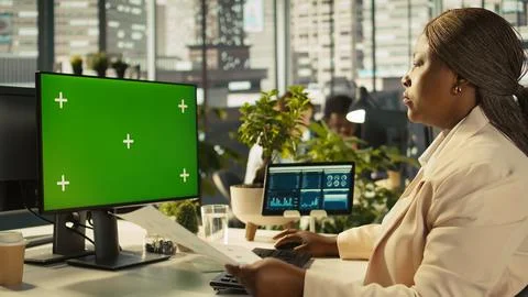 Employee at work using isolated screen PC display to finish project tasks Stock Photos
