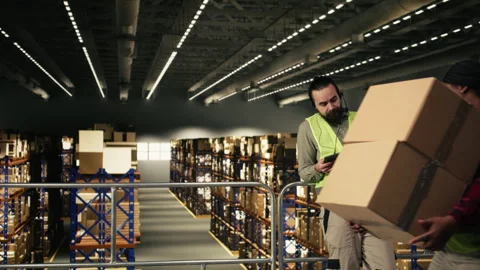 Employee working as a call center agent within distribution center Stock Footage 330205454