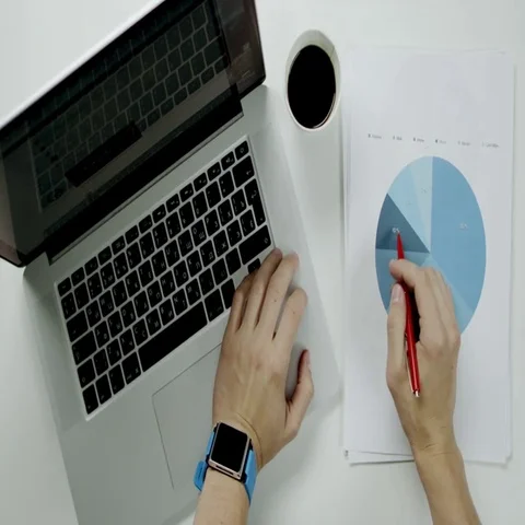 Employee working with diagram using notebook Stock Footage 69399078