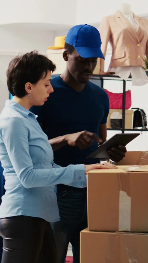 Employees checking cardboard boxes | Stock Video | Pond5