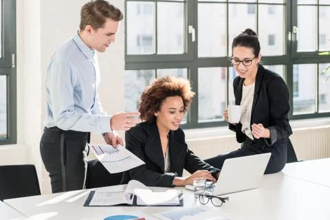 Employees checking together documents and business reports Stock Photos