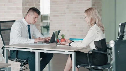 Employees entering data on laptop Stock Footage 164895186