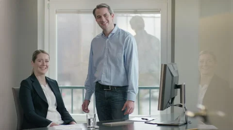 Employees at office smiling at camera Stock Footage 66890801