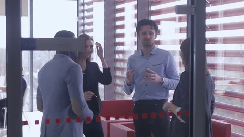 Employees spending their pause with partners in the office breakout area Stock Footage 75574291