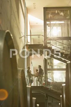 Employees talking on platform in winery Stock Photos