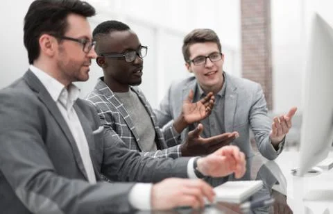 Employees using a computer to analyze data Stock Photos