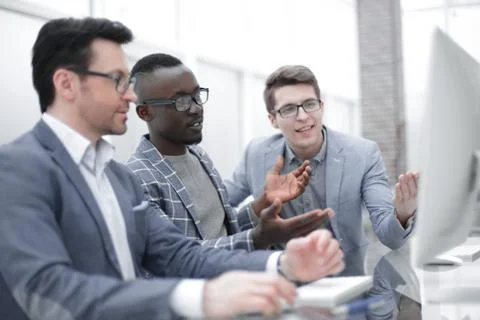 Employees using a computer to analyze data Stock Photos