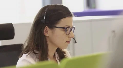 Employees working in call centre office with headsets Stock Footage 67345358