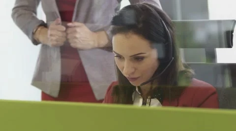 Employees working in call centre office with headsets Stock Footage 67346772