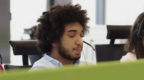 Employees working in call centre office with headsets 스톡 동영상 67346869