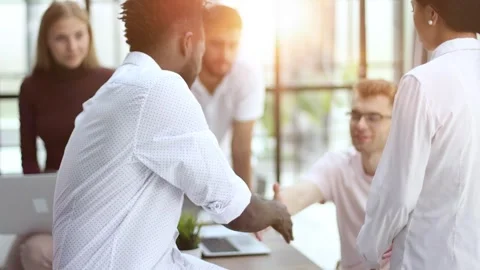 Employees working at computer together, discussing content. Intern learning new Stock Footage 263894827