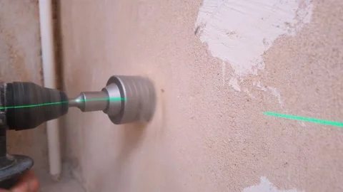 Employing Laser Tools For Accurate Pipe Installation Through Wall Surfaces Stock Footage 328521758