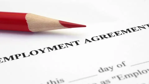 Employment Agreement Document with Red Pencil Close-Up Stock Footage 334893735