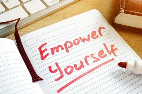 Empower yourself handwritten in a notepad. Foto stock
