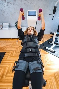Empowered strength training session with muscle stimulation Stock Photos
