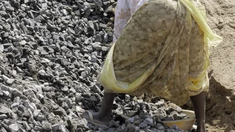 Empowering Rock Picking - A Labor of Progress Stock Footage 314467548