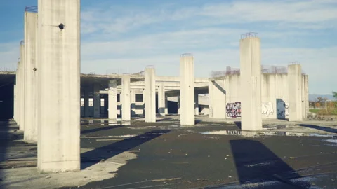 Empty, abandoned construction site with concrete pillars, exterior. Stock Footage 142673574