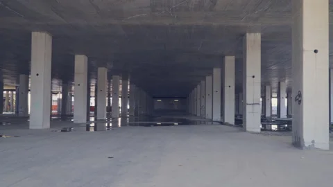 Empty, abandoned construction site with concrete pillars, interior. Stock Footage 142673971