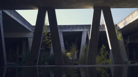 Empty, abandoned construction site with concrete pillars, interior. Stock Footage 142674374