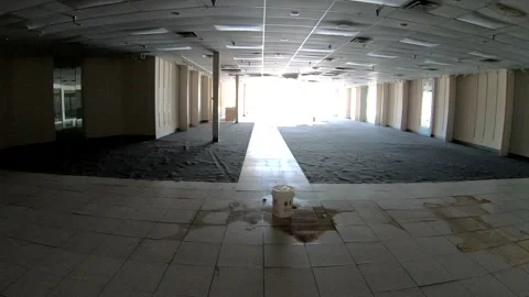 Empty Abandoned Retail Store in a Dead Mall | Handheld 4k 24fps Stock Footage 136671284