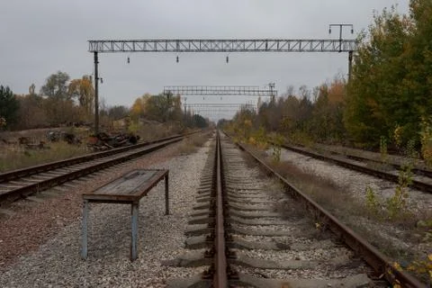 Empty abandoned train tracks leading into the distant vanishing point in Prip Stock Photos