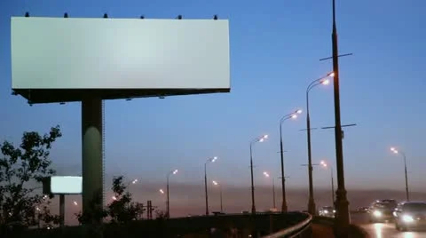 Empty advertising billboard on sidelines of road with traffic Stock Footage 12044731