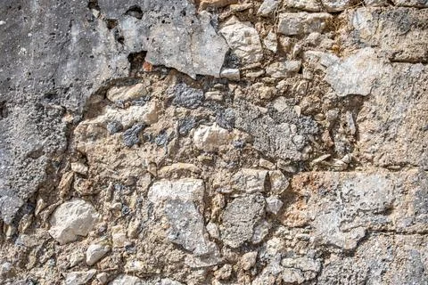Empty aged stonewall material background texture. Old, worn, distressed stone Stock Photos