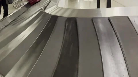 Empty Airport Baggage Carousel in Arrivals Reclaim Area, Close-up view Видео 345062471