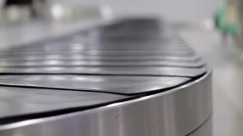 Empty airport baggage claim carousel, selective focus on rounded turn Stock Footage 320117819