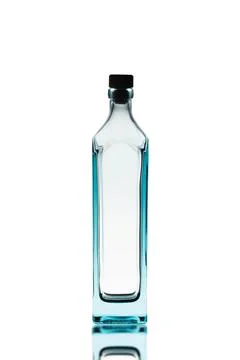 Empty alcohol bottle on a white background.There is a reflection on the botto Stock Photos