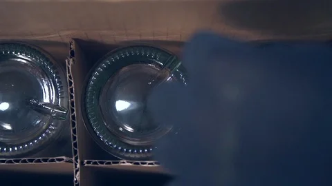 Empty alcohol bottles in supply box before during bottling process Video stock 87119452