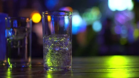 Empty alcohol glass with disco light in nightclub 스톡 동영상 83485500
