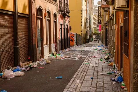 An empty alley full of garbage on the next morning after the Daytime Carni... Stock Photos