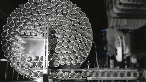 Empty aluminum beer cans move along a conveyor to be filled. Stock Footage 284407262