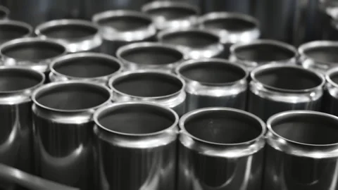 Empty aluminum beer cans move along a conveyor to be filled. Stock Footage 284497086