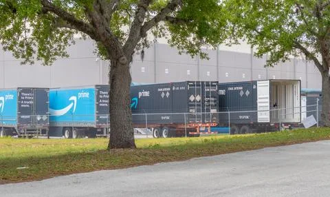 Empty Amazon Prime trailers parked at distribution center Stock Photos
