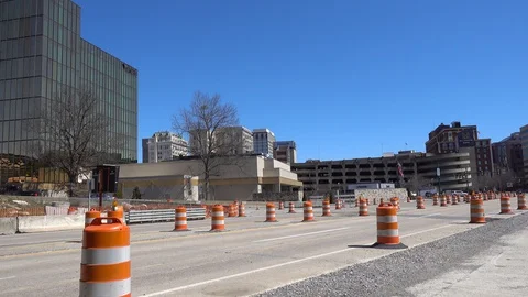 Empty American Town With Construction Road Pylons And Some Traffic In Distan Stock Footage 129688145