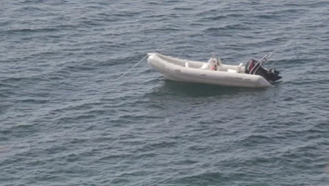 Empty anchored boat (long-focus lens) Stock Footage 8742359