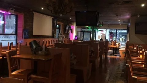 Empty and barren dining area inside restaurant closed during COVID19 pademic Stock Footage 127852804