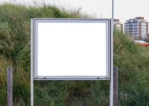 Empty and blank metallic information board to put what ever you want with a g Stock Photos
