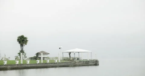 Empty and closed restaurant on Alpine lake on a cold winter day Stock Footage 231448775