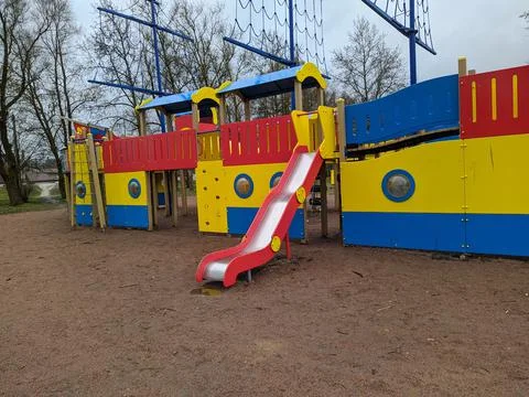 Empty and deserted playground on a cloudy day Stock Photos