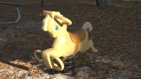 Empty and deserted playground riding horse Stock Footage 87952192