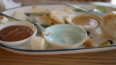 Empty Appetizer Plate With Bread And Dipping Sauces After Meal In Casual Stock Footage 338320972