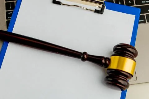 An empty application form of document and wooden gavel isolated. Stock Photos